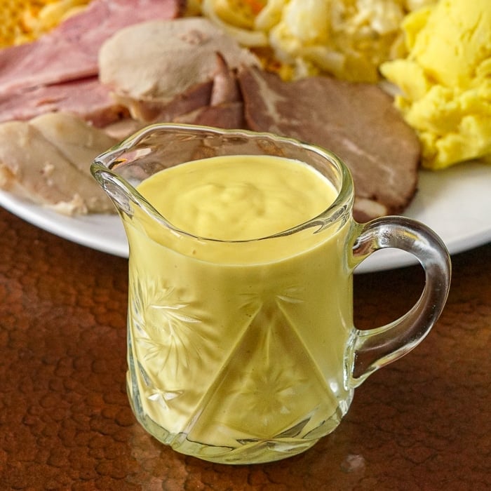 Sweet Mustard Sauce shown in small crystal glass jug
