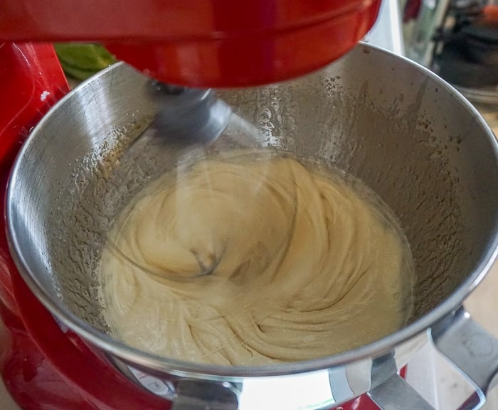 Adding the oil and butter to the eggs and sugar