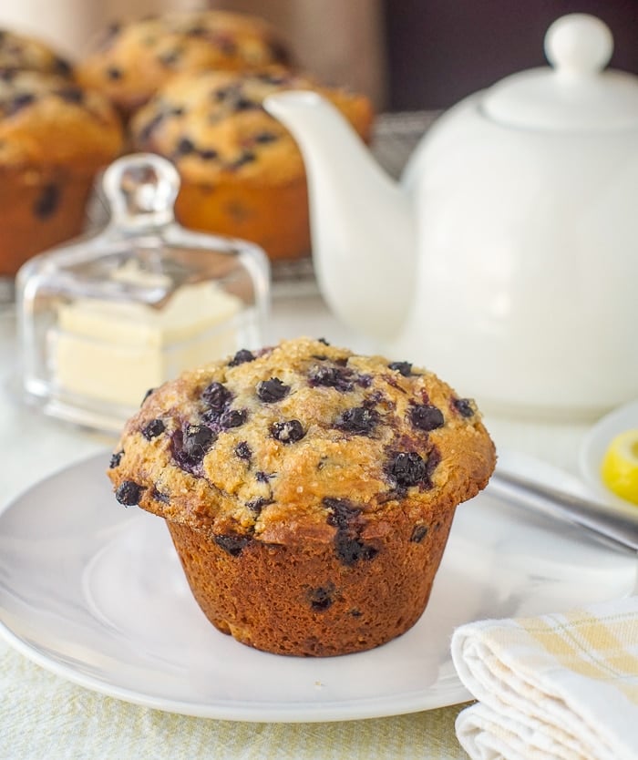 Bakery Style Blueberry Muffins being served at afternoon tea on white dish service