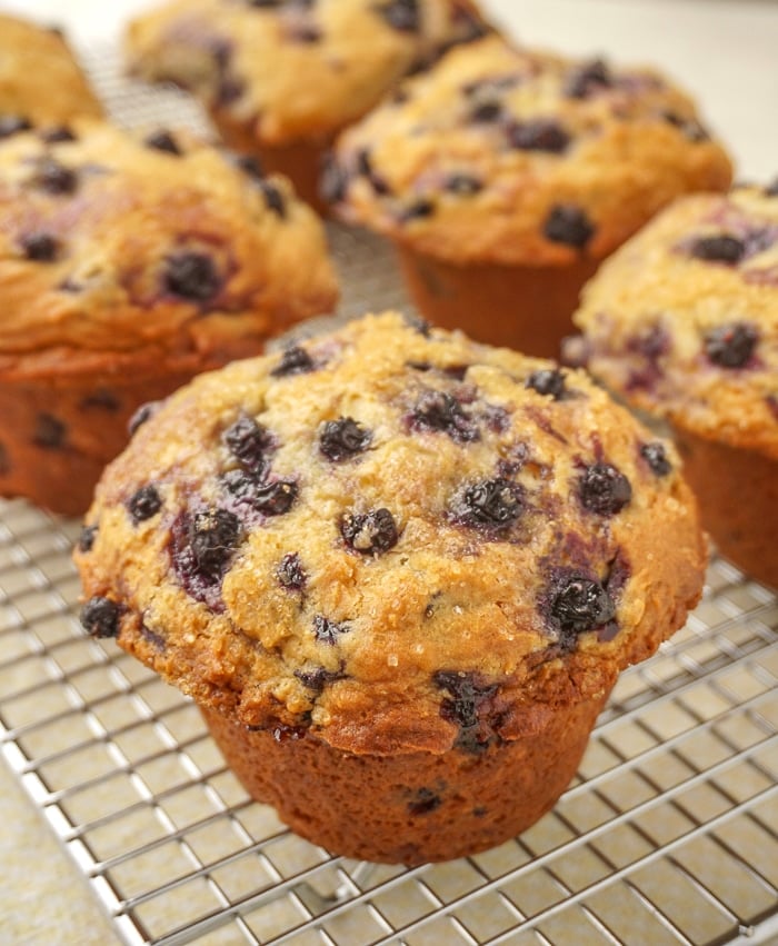 Bakery Style Blueberry Muffins cooling on a wire rack