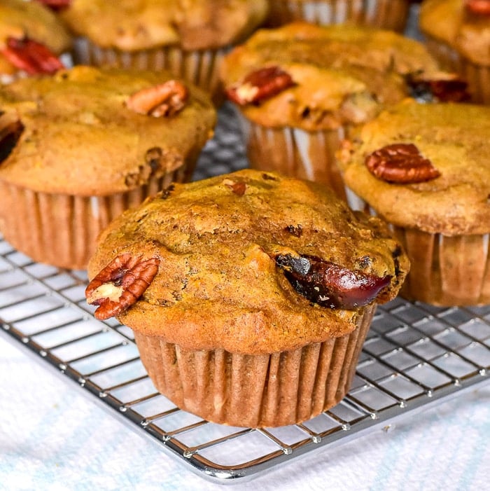 Orange Date Muffins close up photo of muffins cooling on a wire rack