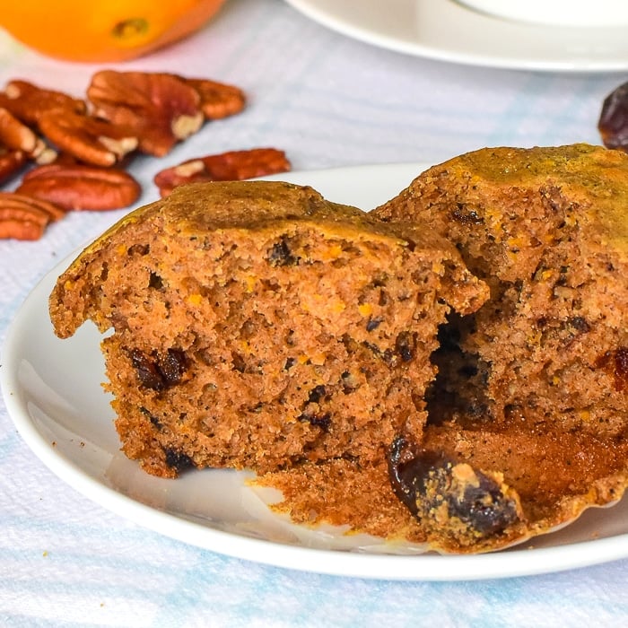 Orange Date Muffins close up photo of one muffin split in half