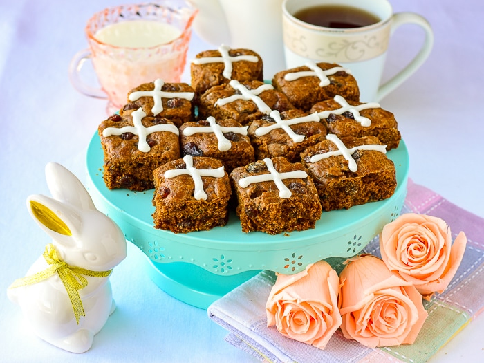 Easter tea service photo with roses and Molasses Raisin Tea Buns on a teal pedestal