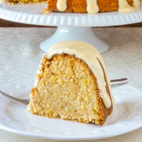 Piña Colada Pineapple Pound Cake close up photo of a single slice on a white plate