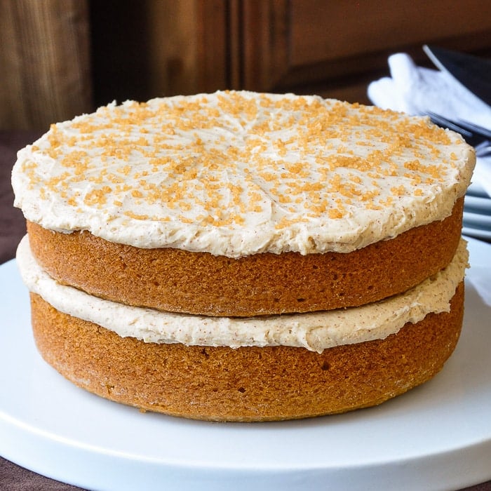 Spice Velvet Cake wide shot of entire uncut cake on a white serving plate