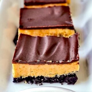 Oreo Peanut Butter Bars close up image on white serving plate