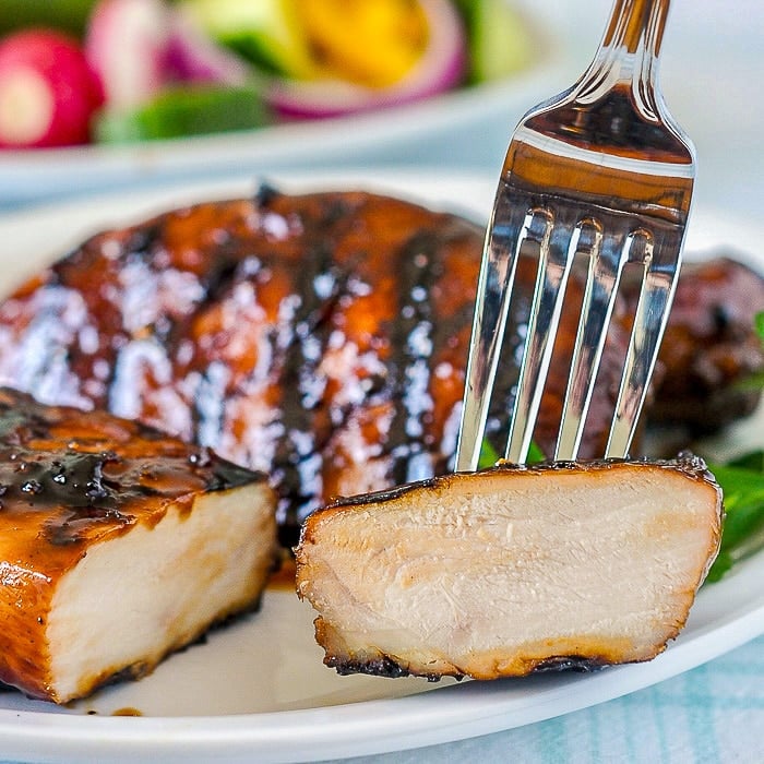 Asian Glazed Chicken Breasts close up showing cut interior of the meat.