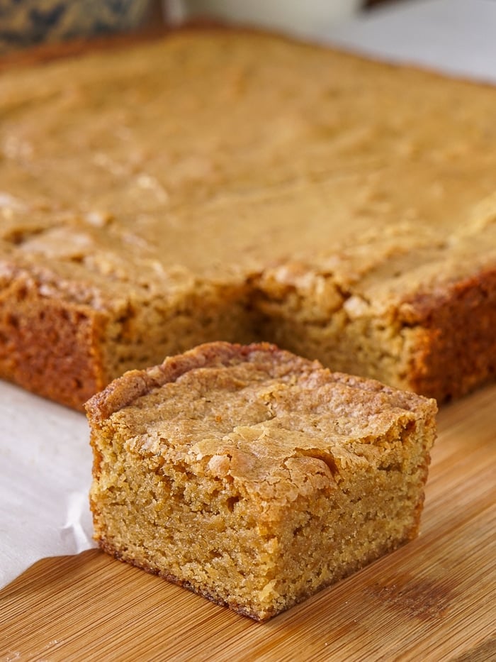 The Best Blondies on a wooden cutting board