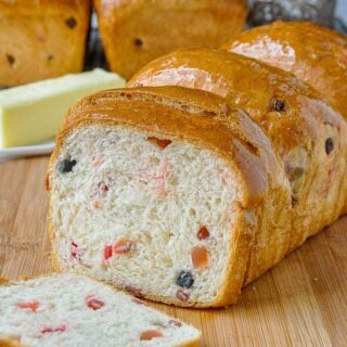 Christmas Fruit Bread close up photo of one sliced loaf of bread