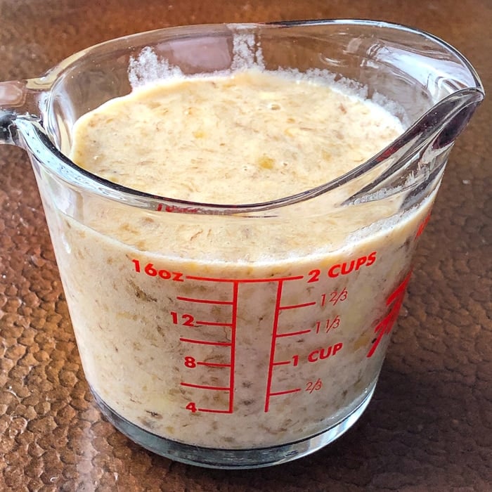 Banana puree in a measuring cup