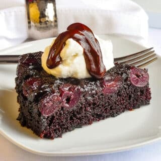 Chocolate Cherry Upside Down Cake single slice on a white plate