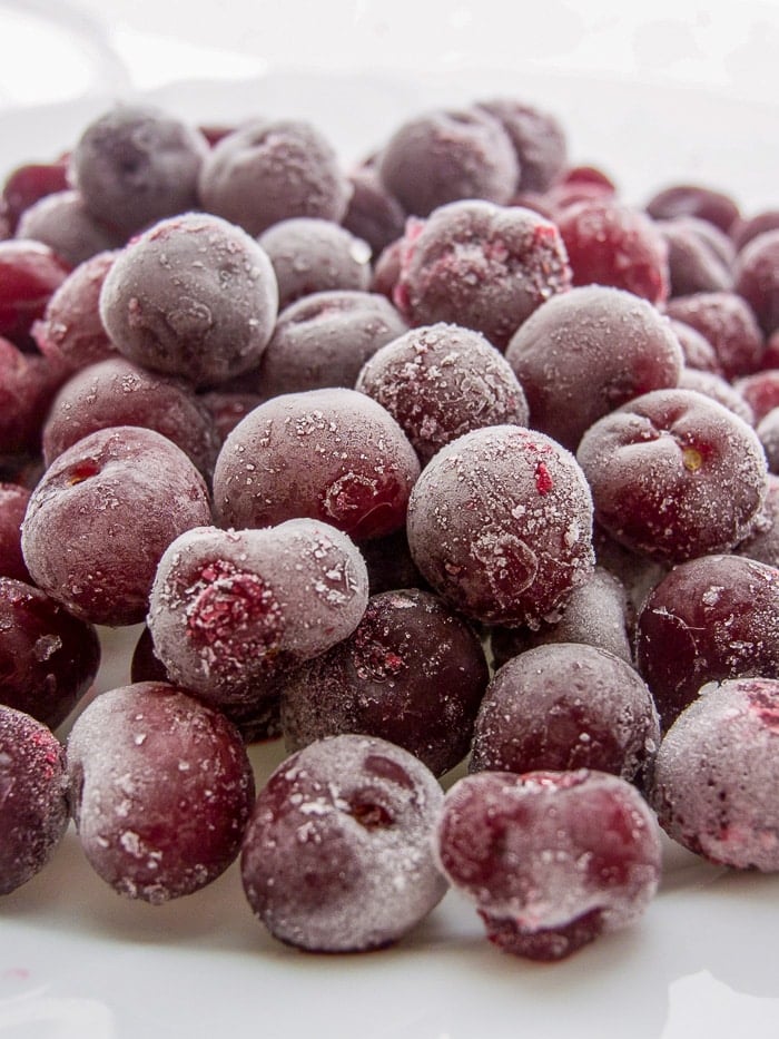 frozen cherries isolated on a white background