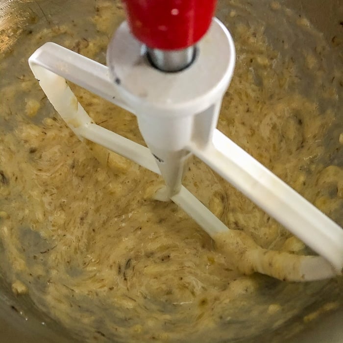 Bananas being mashed in a mixer