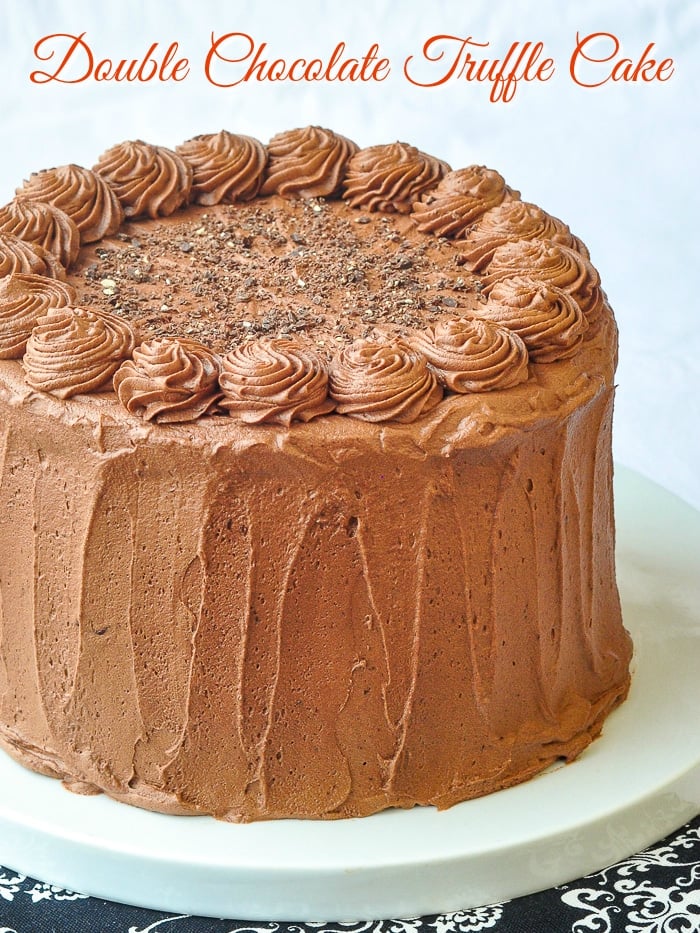 Triple Chocolate Truffle Cake photo of uncut cake with title text added for Pinterest