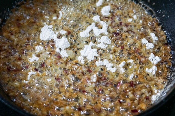 Adding the flour to the skillet