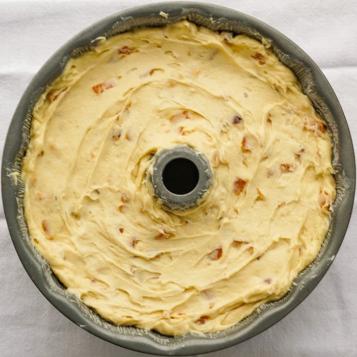 Apricot Hazelnut Pound Cake photo of cake batter in a bundt pan ready for the oven