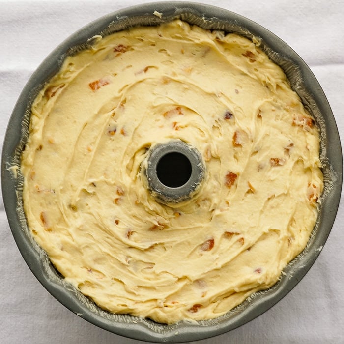 Apricot Hazelnut Pound Cake photo of cake batter in a bundt pan ready for the oven