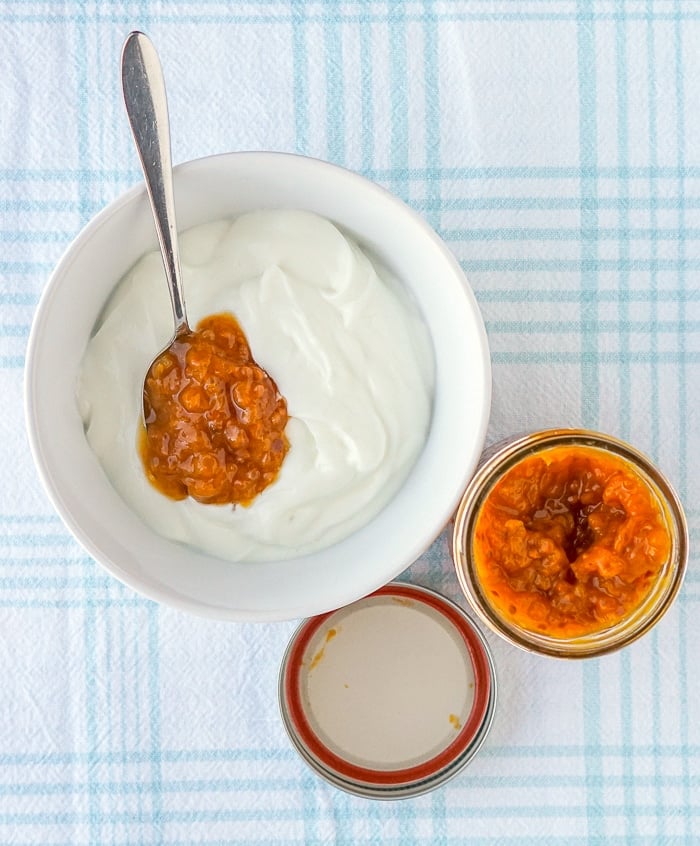 Bakeapple jam added to plain yogurt with jam jar on the side