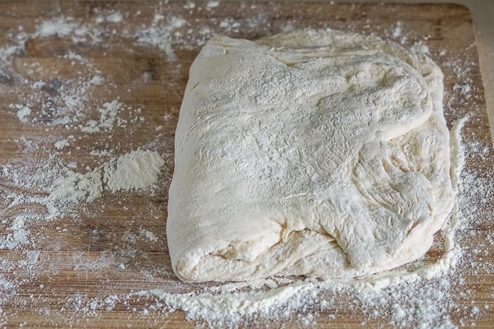 Begin folding the dough into shape