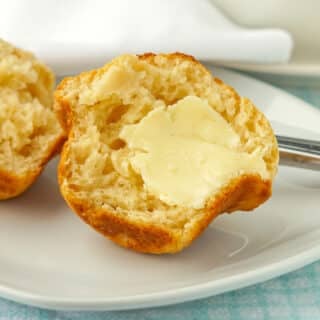 Biscuit Muffin Bread close up photo smeared with butter