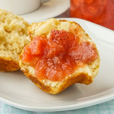 Biscuit Muffin Bread close up photo with butter and jam
