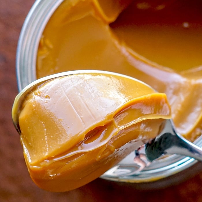 Caramel Dulce de Leche close up photo of a spoonfull scooped from the can