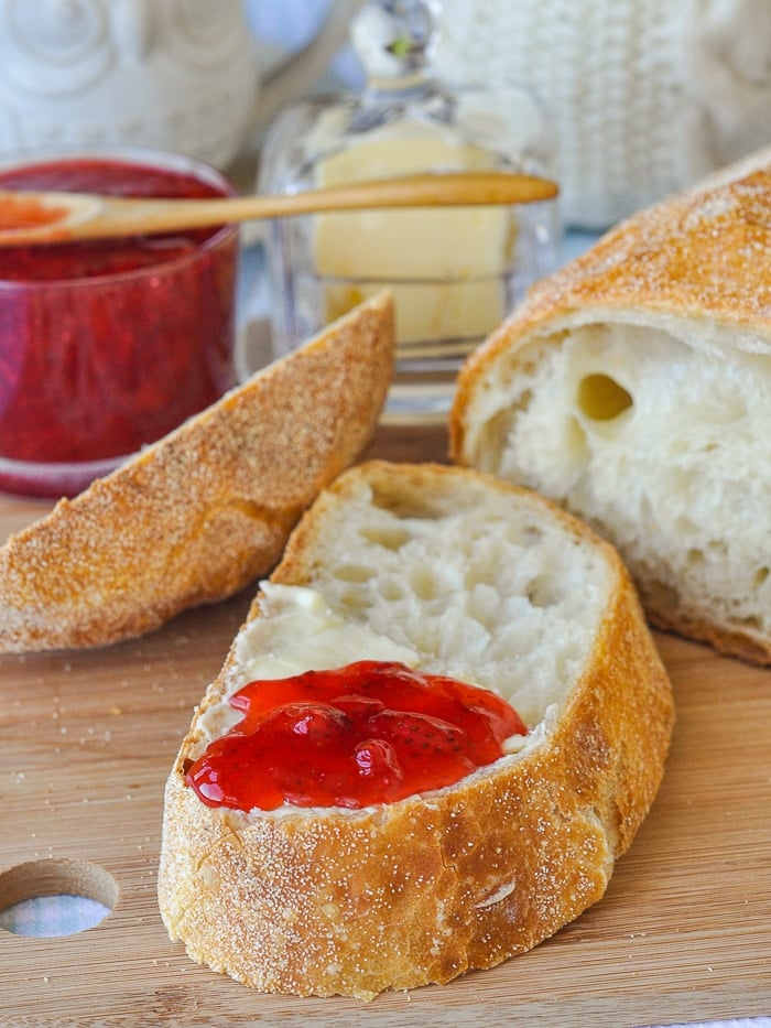 Close up photo of a slice of bread with jam.