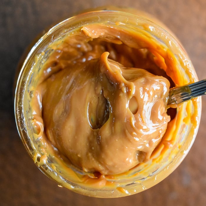 Finished Dulce de Leche Caramel stored in a mason jar.