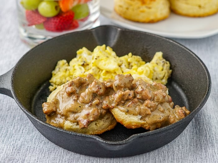 Southern Sausage gravy and biscuits served in a small skillet