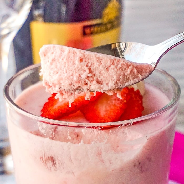 Strawberry Marshmallow Mousse close up photo of a spoon scooping the mouse out of a dish