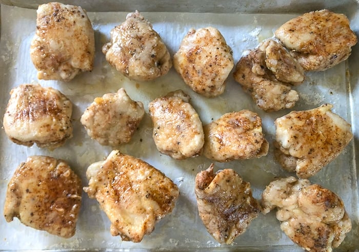 Turn the chicken pieces after about 20 minutes in the oven.
