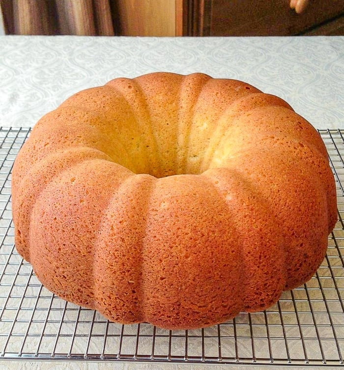 Vanilla Cream Cheese Bundt Cake cooling on a wire rack