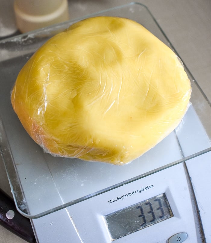 Wrap portions of dough in plastic wrap and rest in the fridge.