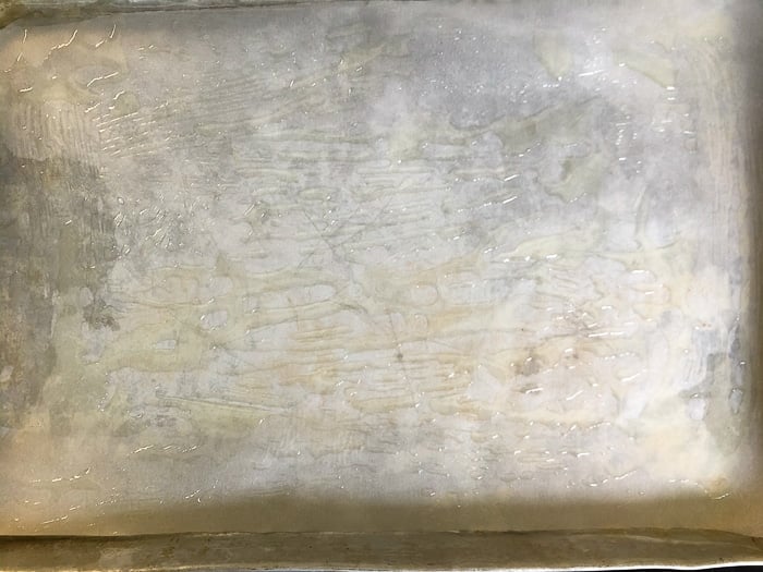 Lightly brush a baking sheet with canola oil
