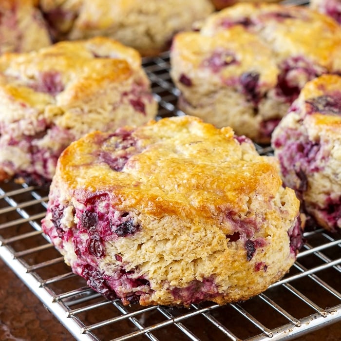 Close up photo of one scone cooling on a wire rack