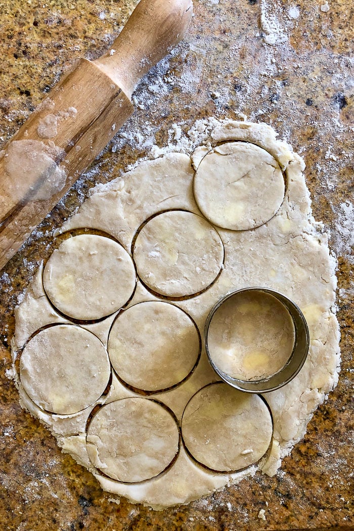 Cutting circles of pastry with a cookie cutter