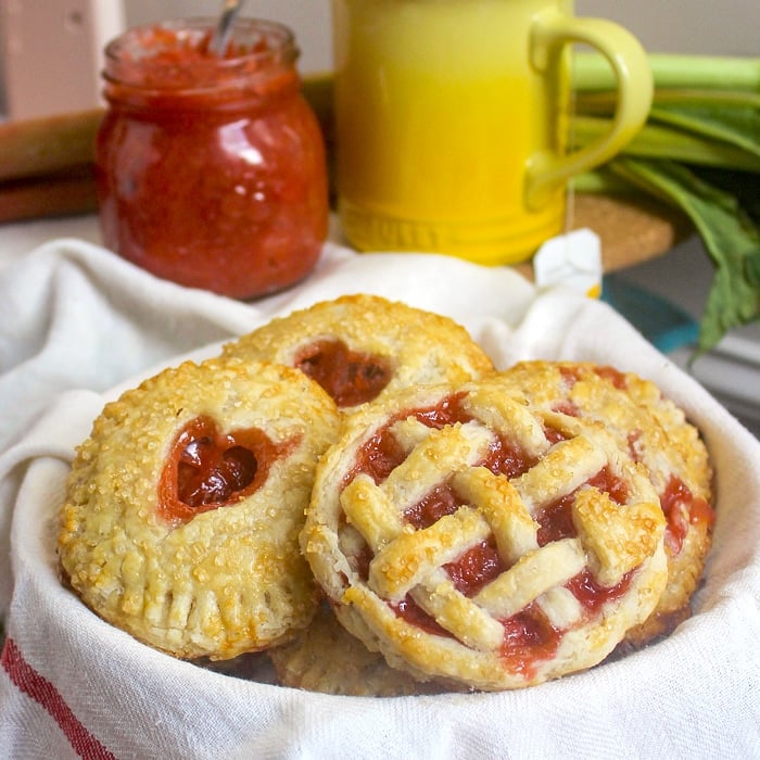 Oven Baked Hand Pies close up photo of pies in a teatowel lined basket