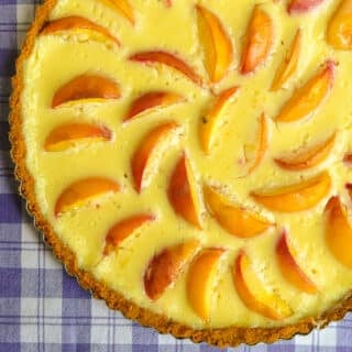 Summer Peach Custard Tart close up photo of uncut tart