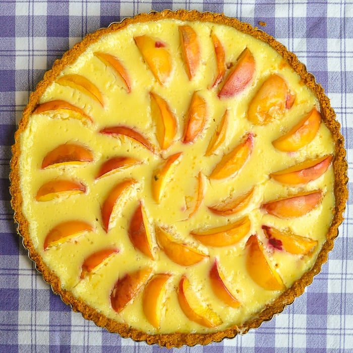 Summer Peach Custard Tart overhead overhead photo of uncut tart.