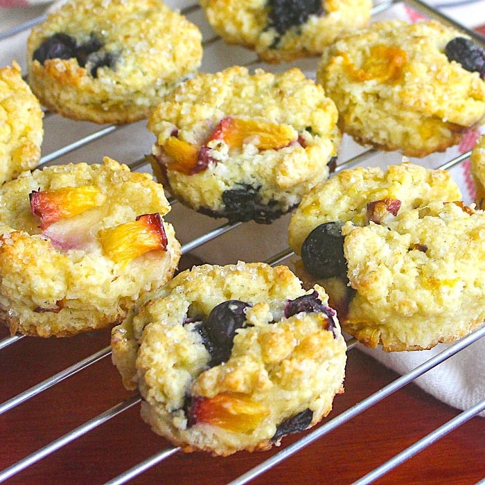 Blueberry Peach Coconut Scones close up photo of scones cooling on a wire rsack