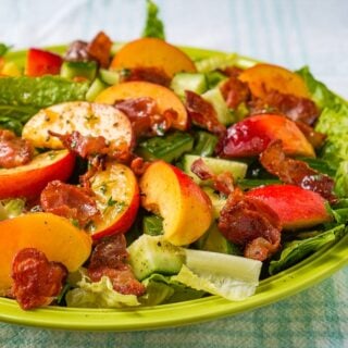 Close up featured photo of Honey Lemon Vinaigrette on Peach Bacon Salad