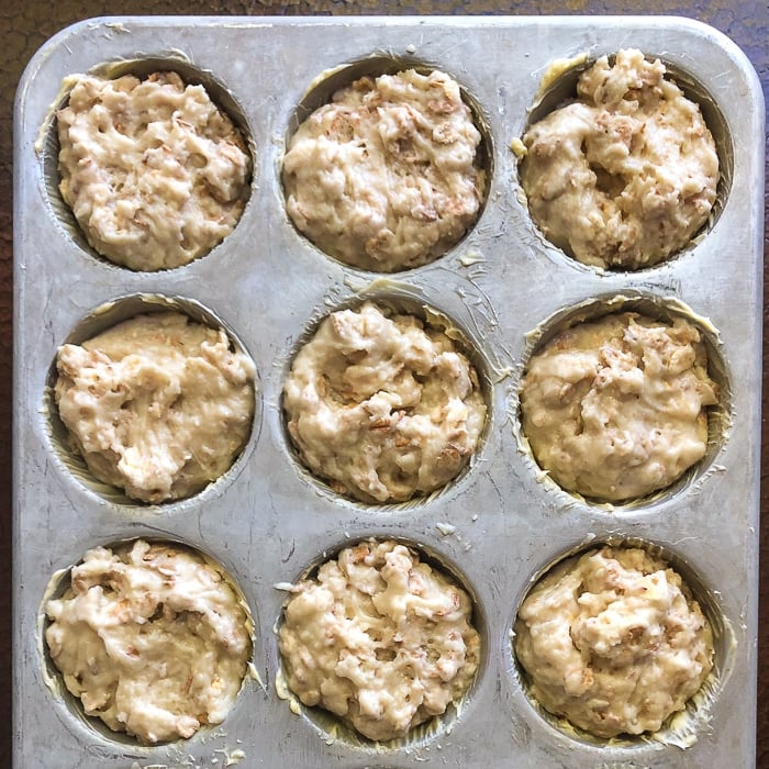 Muffin batter in muffin pan ready for the oven.