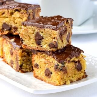 The Easiest Chocolate CHip Squares photo of cookies stacked on a white plate