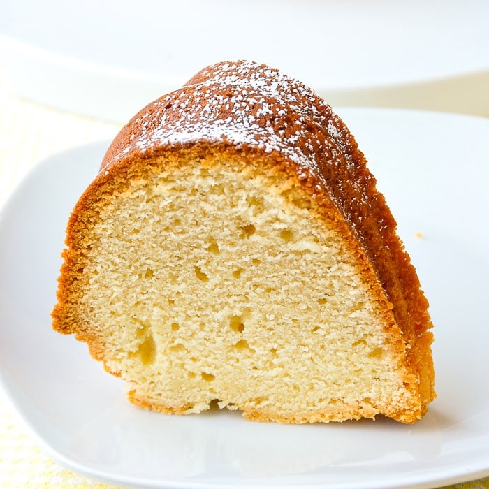 The best vanilla pound cake recipe close up photo of one slice on a white plate