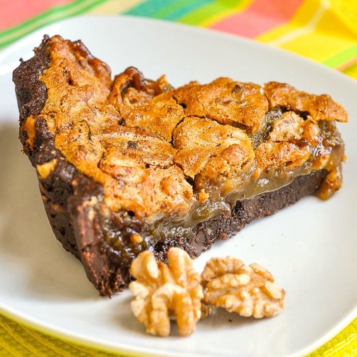 Walnut Brownie Pie photo of a singe slice on a white plate