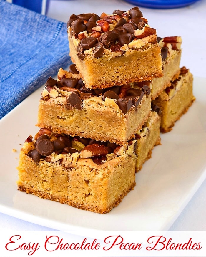 Chocolate Pecan Blondies being cut on a wooden cutting board with title text added for social media.