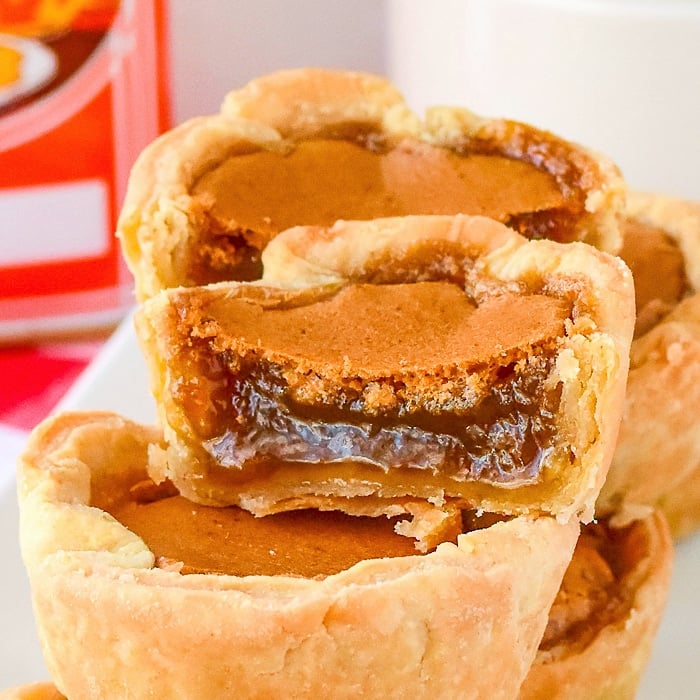 Close up photo showing the filling of one butter tart