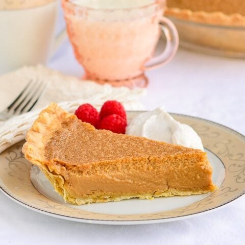 One slice of Gypsy Tart on a pink and gold pattern tea service