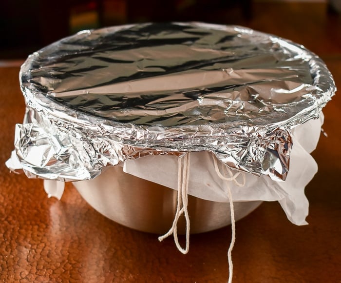 A couple of layers of aluminum foil will secure the top even more