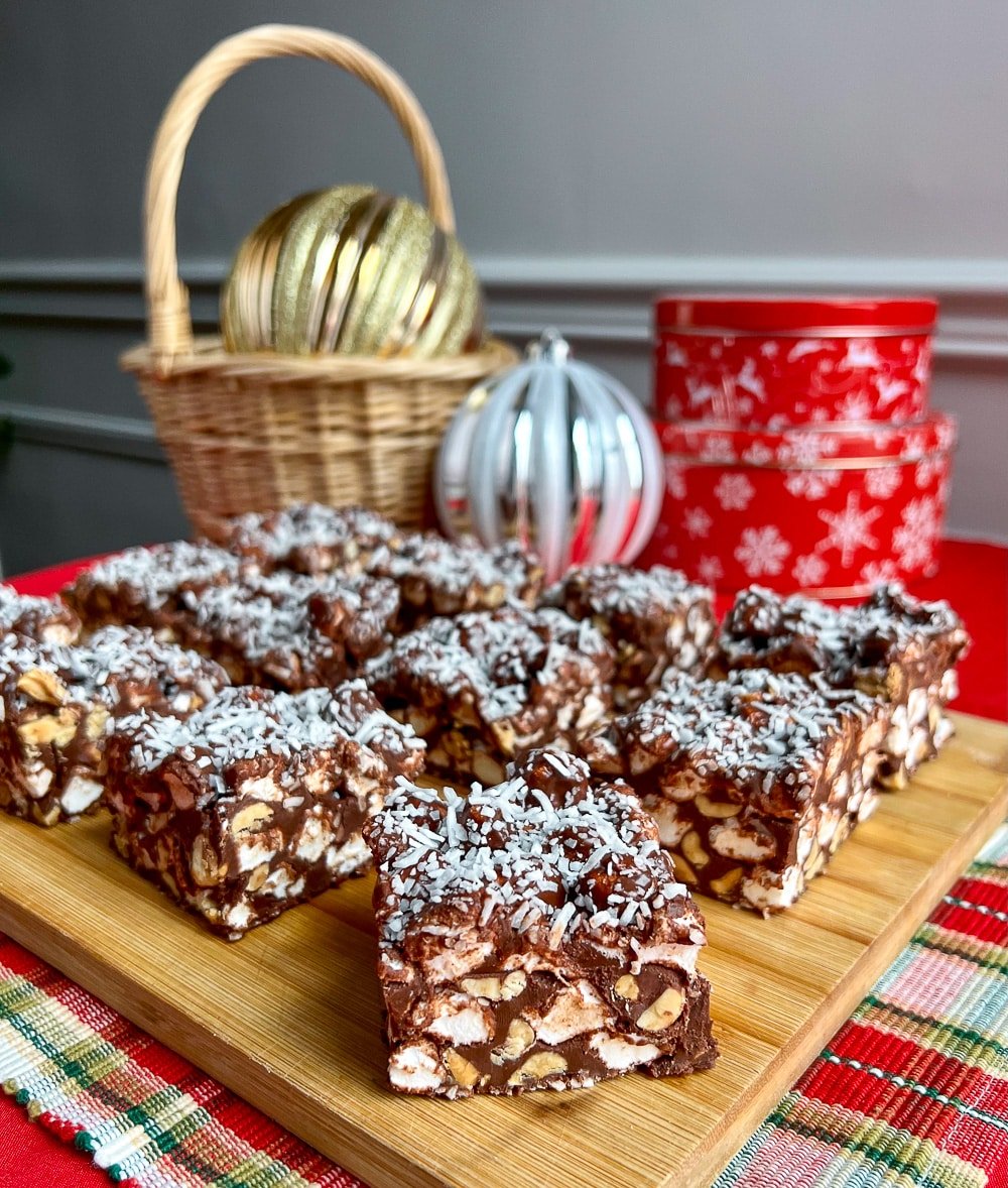 Peanut Butter Rocky Road Bars on a wooden cutting board